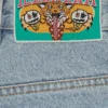 Jeanshose mit „Running Dog“-Motiv und doppeltem Bund